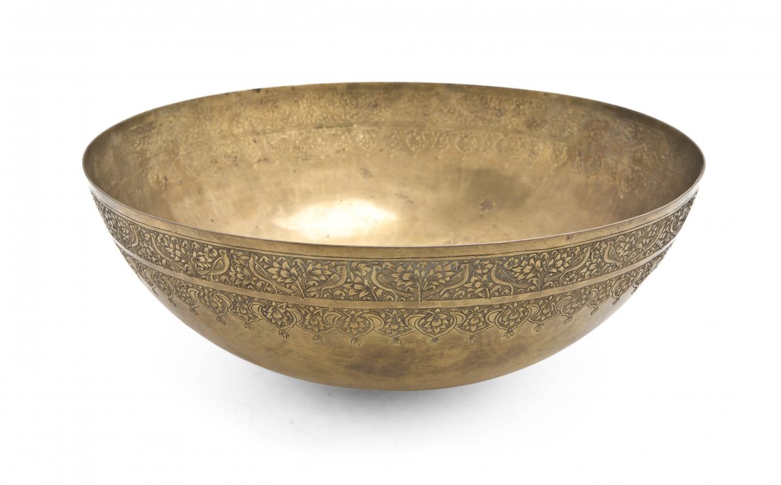A Middle Eastern Brass Bowl, Diameter 12 1/2 inch: A Middle Eastern Brass Bowl, of hemispherical form with flattened bottom, having bird and foliate etched border. Diameter 12 1/2 inches.