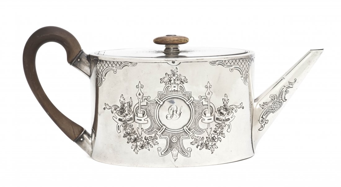 An English Silver Coffee Pot, Andrew Fogelberg &: An English Silver Coffee Pot, Andrew Fogelberg & Stephen Gilbert, London, 1786, of oval form with wood handle and finial, having relief and etched decoration; approximate total weight overall 14.26 oz