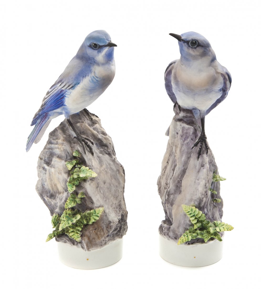 A Pair of Royal Worcester Dorothy Doughty Birds, : A Pair of Royal Worcester Dorothy Doughty Birds, Mountain Bluebirds, perched on naturalistic rock form bases with spleenwort niger. Height 9 1/2 inches.