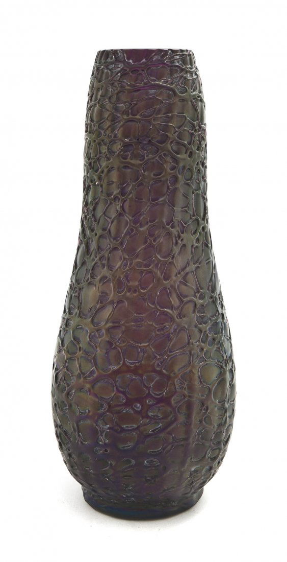 An Austrian Iridescent Glass Vase, attributed to: An Austrian Iridescent Glass Vase, attributed to Loetz, of baluster form with applied stringing on a violet ground. Height 11 5/8 inches.