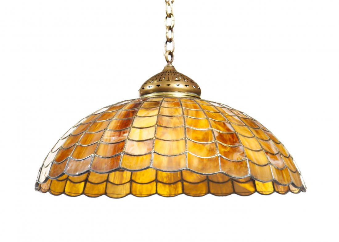 An American Geometric Leaded Glass Shade, attribu: An American Geometric Leaded Glass Shade, attributed to Tiffany Studios, of domed form with scale decoration, having partial tag reading New York, with Neoclassical bronze ceiling mount, adapted. Diam
