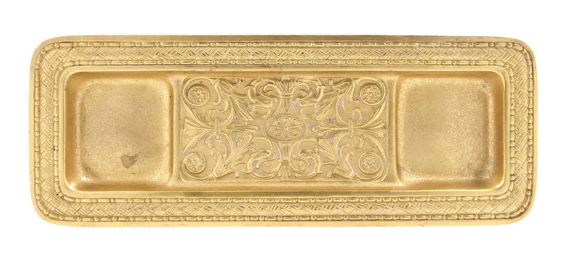 A Tiffany Studios Gilt Bronze Pen Tray, Length 9 : A Tiffany Studios Gilt Bronze Pen Tray, in the Spanish pattern, of rectangular form with cast woven and foliate motifs, stamped Tiffany Studios New York 1882. Length 9 7/8 inches.
