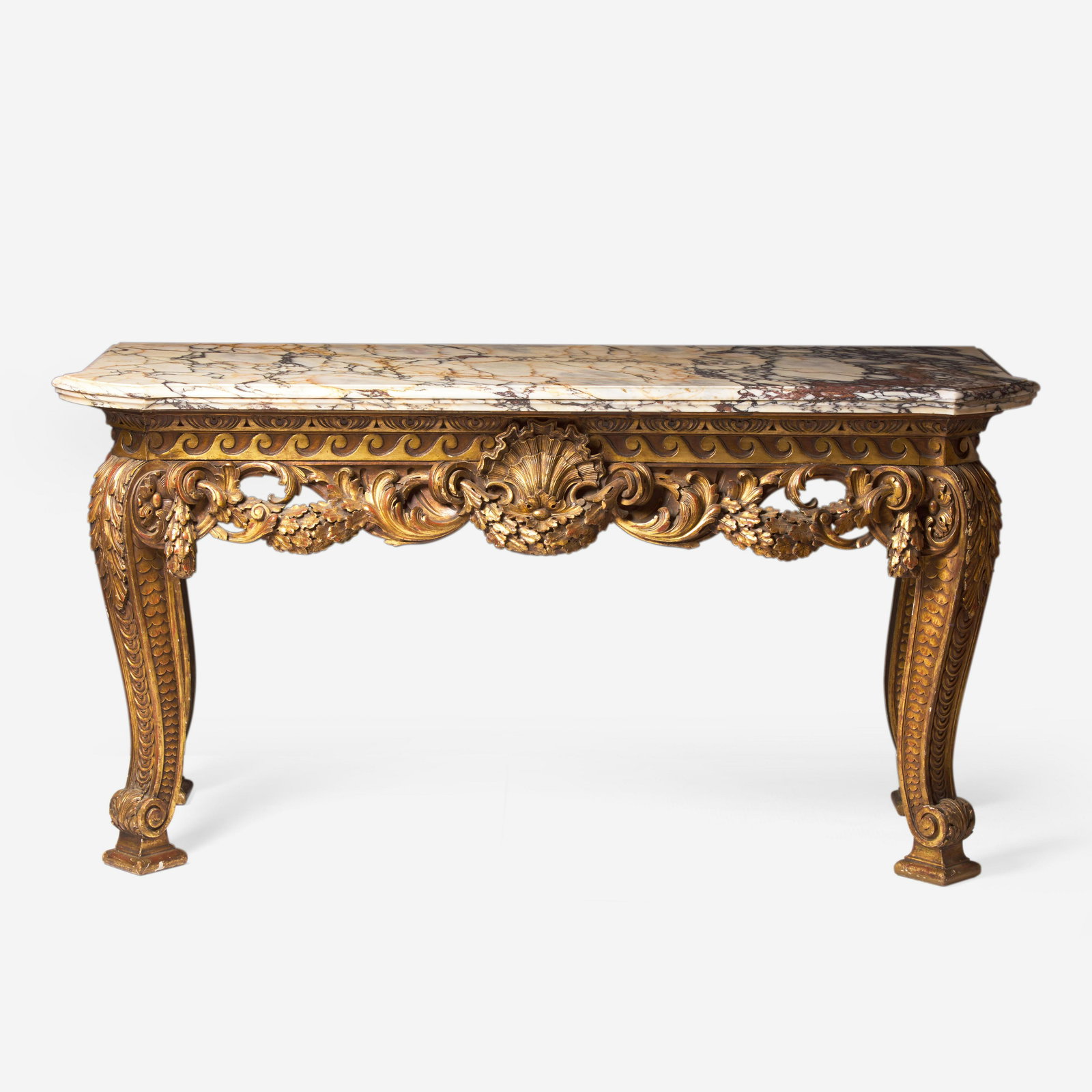 A George I style giltwood side table with breccia marble top In the style of William Kent (English,: A George I style giltwood side table with breccia marble top In the style of William Kent (English, 1685-1748), 19th century The rectangular marble top with outset front corners, on a giltwood base fe