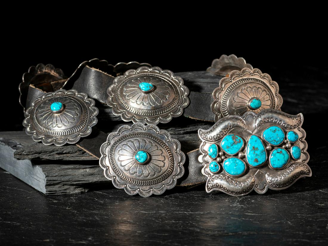 Orville Tsinnie (Diné, 1943-2017) Sterling Silver and Morenci Turquoise Concha Belt: Orville Tsinnie (Diné, 1943-2017) Sterling Silver and Morenci Turquoise Concha Belt nine heavily stamped oval conchas with scalloped edges, each set with a single turquoise cabochon; the rectangu
