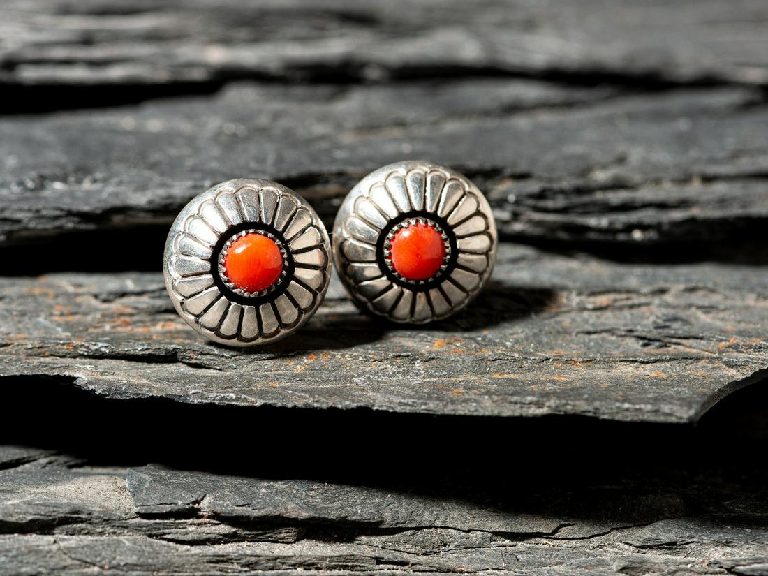 Lee Yazzie (Diné, b. 1946) Pair of Silver and Coral Screwback Earrings: Lee Yazzie (Diné, b. 1946) Pair of Silver and Coral Screwback Earrings each signed LEE YAZZIE diameter 5/8 inch each, combined weight 3.2 dwt. This lot is located in Cincinnati. From the Collecti