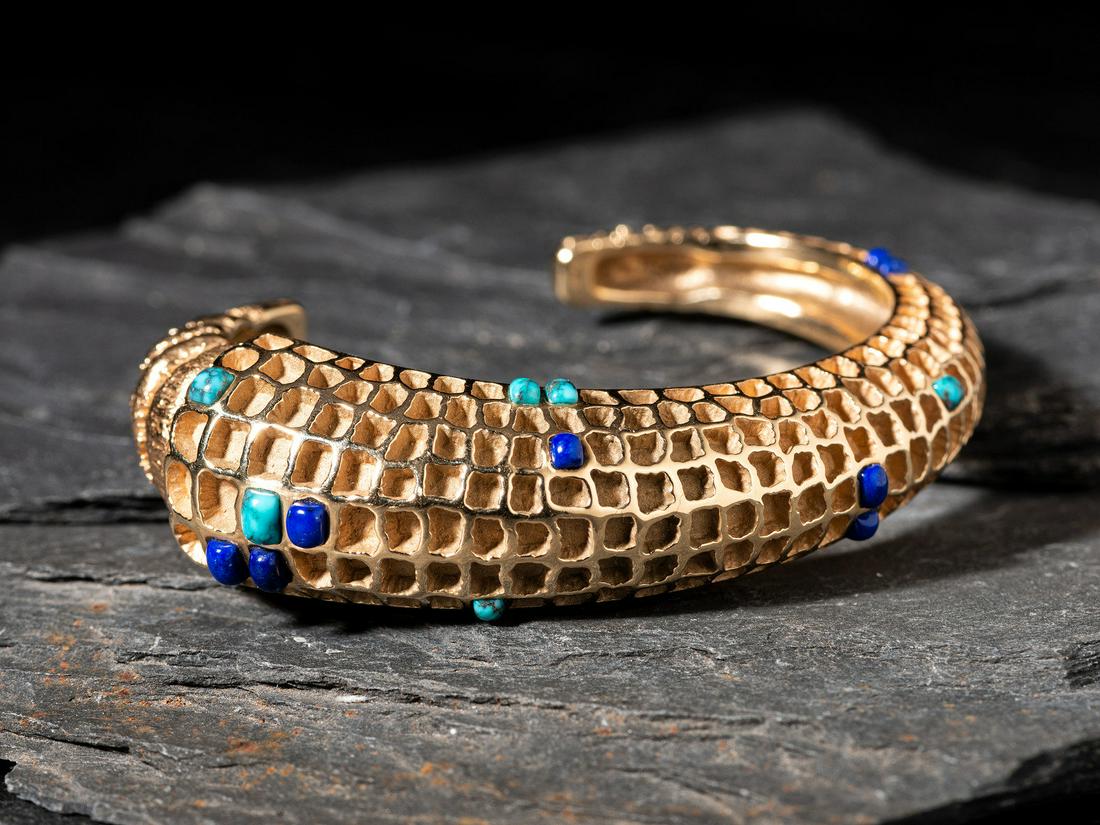 James Little (Diné, b. 1947) Tufa Cast 14K Gold Corn Cob Cuff Bracelet: James Little (Diné, b. 1947) Tufa Cast 14K Gold Corn Cob Cuff Bracelet tapered design set with small kernels of lapis and turquoise; marked JL inside an arrow hallmark cuff width 3/4 inch, interi