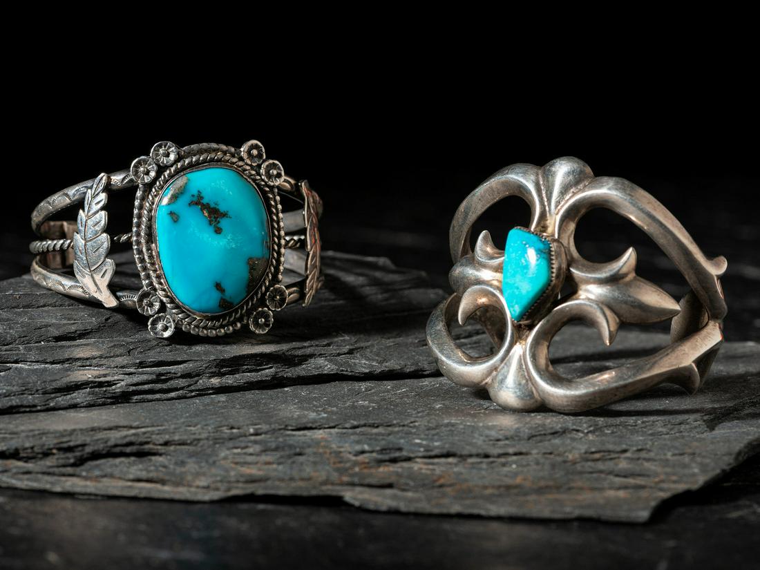 Navajo Silver and Turquoise Cuff Bracelets: Navajo Silver and Turquoise Cuff Bracelets third quarter 20th century lot of 2, includes: a sand cast example; not marked cuff width 2 inches, interior circumference 5-1/4 inches x gap length 1 inch,