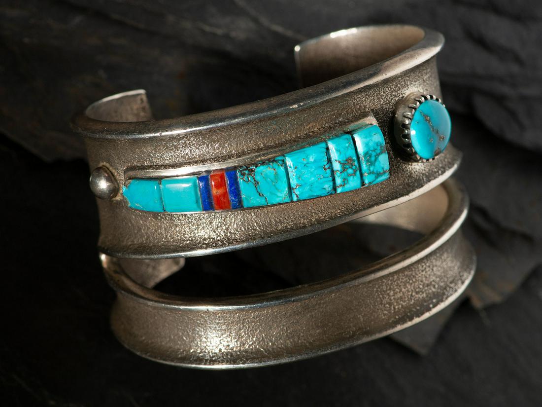 Edison Cummings (Diné, b. 1962)  Tufa Cast Silver Cuff Bracelet, with Inlaid Abstract Figural (1 of 3)