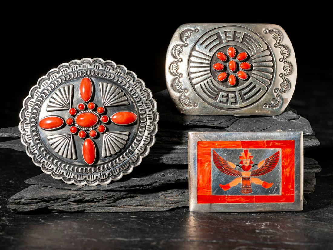 Navajo and Zuni Sterling Silver and Coral Belt Buckles: Navajo and Zuni Sterling Silver and Coral Belt Buckles second half 20th century lot of 3, includes: a rectangular example with mosaic inlay Knife Wing; stamped H.M.COONSIS STERLING etched ACHIYA LA.DA