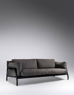 Rodolfo Dordoni (Italian, b. 1954) Eloro Sofa, c. 2008 Cassina, Italy: Rodolfo Dordoni (Italian, b. 1954) Eloro Sofa, c. 2008Cassina, Italy upholstery, leather, lacquered ash manufacturer's logo on the underside of the upholstery H 32 x W 96 x D 36 inches.