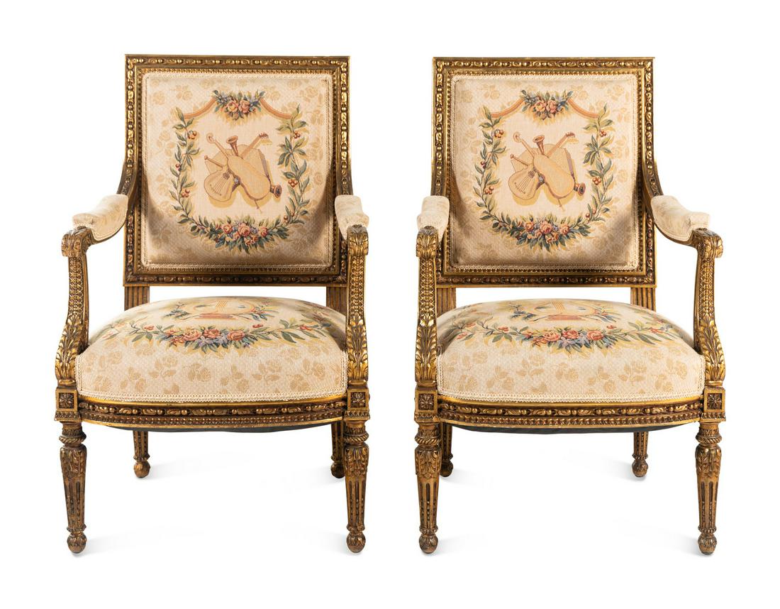 A Pair of Louis XVI Style Tapestry-Upholstered Giltwood Bergères: A Pair of Louis XVI Style Tapestry-Upholstered Giltwood Bergères Late 19th/Early 20th Century Height 39 5/8 x width 25 inches. This lot is located in Chicago.