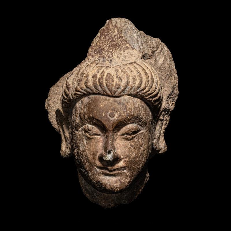 A Gandharan Grey Schist Head of Buddha (1 of 3)