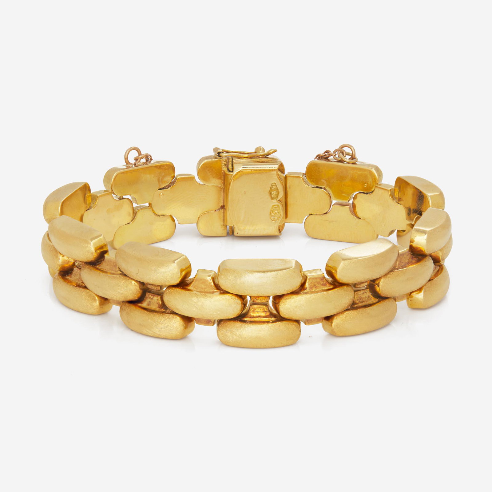 An 18K Yellow Gold Bracelet: An 18K Yellow Gold Bracelet An 18K yellow gold panther-link bracelet crafted from engraved textured links, with box clasp, figure-eight safety latch, and safety chain. (Inner Circumference: 7 1/2in; W