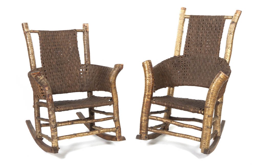 Two American Rustic Adirondack Rocking Chairs, He: Two American Rustic Adirondack Rocking Chairs, each with woven back, arms and seat within birch wood supports. Height of tallest 44 inches.