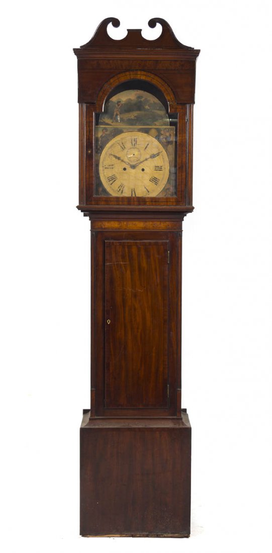 An American Mahogany Tall Case Clock, Height 89 i: An American Mahogany Tall Case Clock, having a hood with a broken arch finial over the painted dial with Roman numerals, raised on a straight trunk. Height 89 inches. Property from O'Hara's Gallery, C