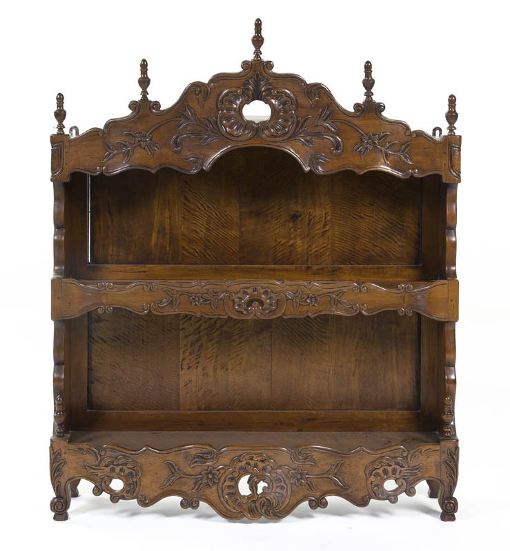 A Victorian Walnut Whatnot Shelf, Height 48 1/8 x: A Victorian Walnut Whatnot Shelf, having a carved valence over two tiers with enclosed sides. Height 48 1/8 x width 39 1/2 x depth 8 1/8 inches.