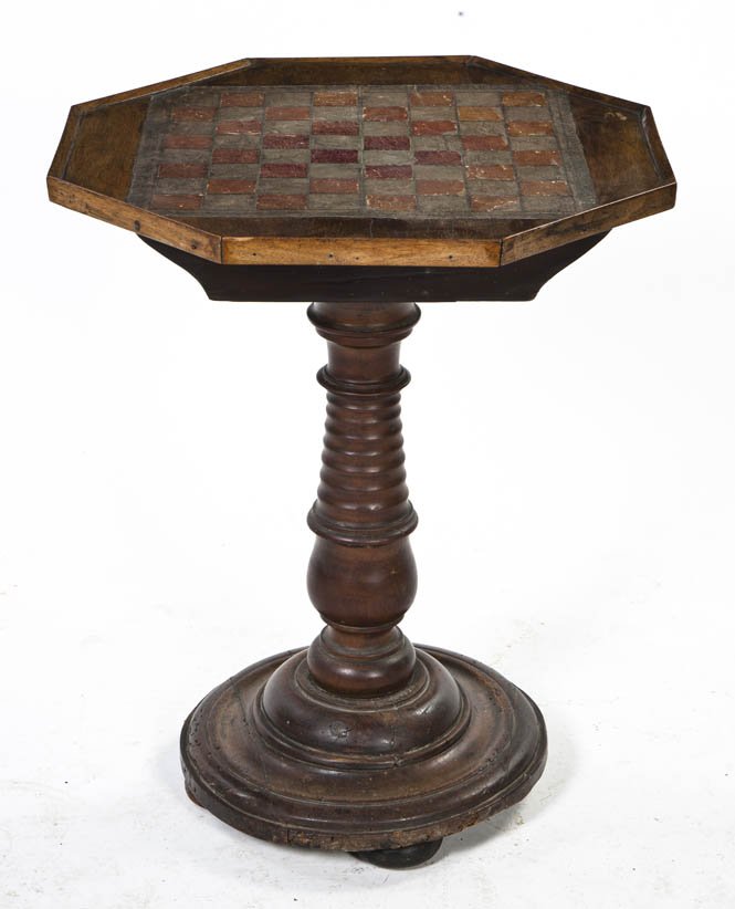 A Continental Mahogany Games Table, Height 24 1/2: A Continental Mahogany Games Table, having an octagonal top centered with a chessboard, raised on a ring turned standard. Height 24 1/2 inches. Property from the Elne Elaine Russ Trust, Winnetka, Illi