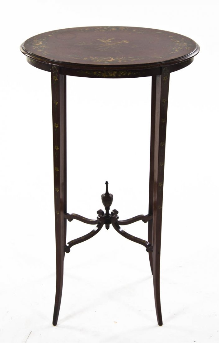 An Edwardian Style Occasional Table, Height 27 1/: An Edwardian Style Occasional Table, having an oval top raised on square tapering legs joined by an X-form stretcher centered with an urn form finial, with foliate decoration throughout. Height 27 1/2
