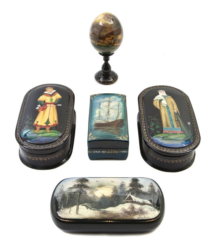 A Group of Four Russian Lacquer Boxes, Width of w: A Group of Four Russian Lacquer Boxes, comprising two decorated with figures and two with landscape scenes, together with a lacquered egg raised on a circular pedestal. Width of widest 5 1/4 inches.