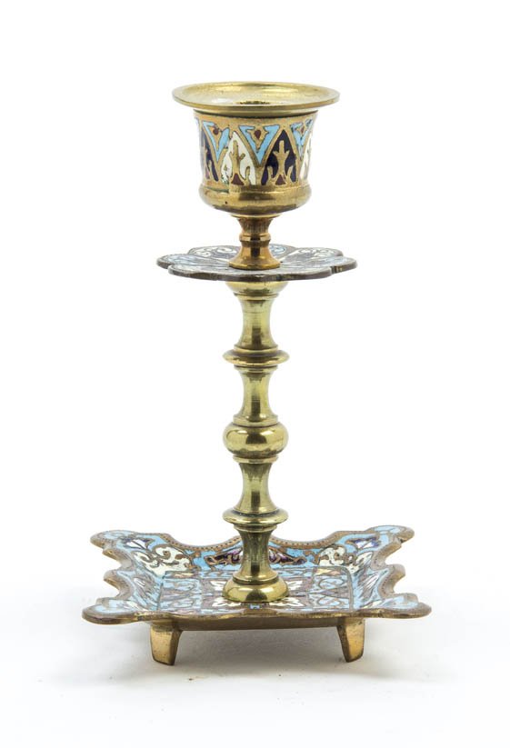 A Continental Gilt Bronze and Champleve Candlesti: A Continental Gilt Bronze and Champleve Candlestick, the candle cup raised on a repeating baluster form standard set on a shaped base raised on four feet. Height 5 1/4 inches.
