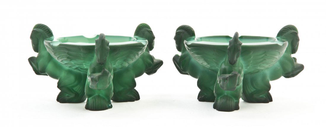 A Pair of Czech Molded Glass Ash Receivers, Width: A Pair of Czech Molded Glass Ash Receivers, the circular bowl supported by three rearing horses. Width 5 1/4 inches.