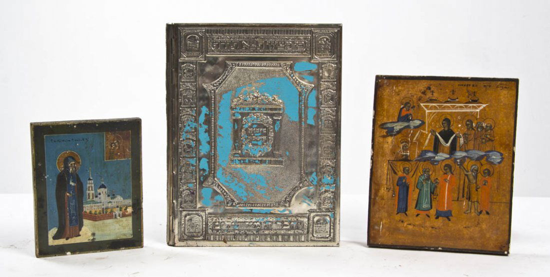A Silvered Metal Bound Copy of the Haggadah, Heig: A Silvered Metal Bound Copy of the Haggadah, executed by Arthur Szyk, together with two Eastern European icons. Height of first 9 x width 7 1/4 inches. Property from O'Hara's Gallery, Chicago, Illinoi