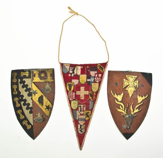 Two Tole Painted Crests, Height of first 8 1/2 in: Two Tole Painted Crests, each of shield form, together with a needlepoint and a watercolor example. Height of first 8 1/2 inches. Property from the Elne Elaine Russ Trust, Winnetka, Illinois