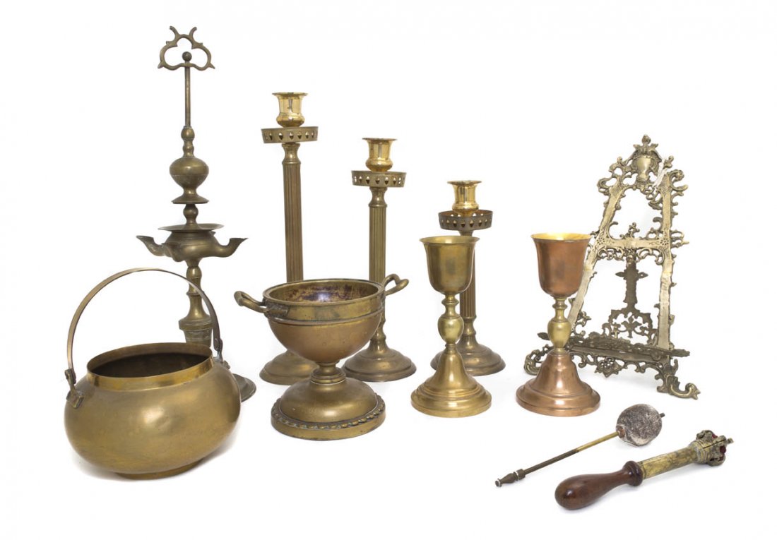 A Collection of Brass Articles, Height of tallest: A Collection of Brass Articles, comprising candlesticks, goblets, an easel and others; 10 items total. Height of tallest 19 inches. Property from the Elne Elaine Russ Trust, Winnetka, Illinois