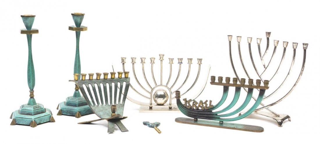 A Group of Mixed Metal Judaica Objects, Height of: A Group of Mixed Metal Judaica Objects, comprising four menorahs of various forms and sizes, a pair of candlesticks and a corkscrew with a bird form handle. Height of tallest 10 1/4 inches.