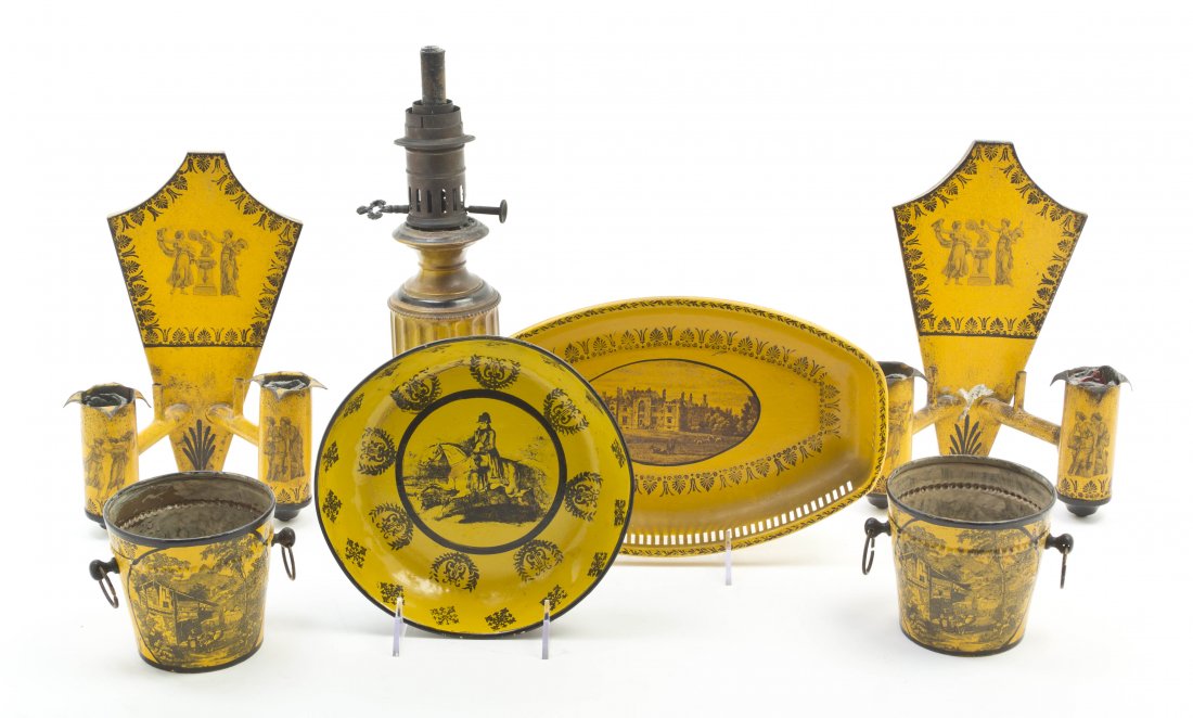 A Collection of Tole Articles, Height of first 9: A Collection of Tole Articles, comprising two two-light sconces, an oil lamp base, two jardinieres, an oval bowl and a circular bowl. Height of first 9 3/4 inches. Property from the Estate of Helen Mo