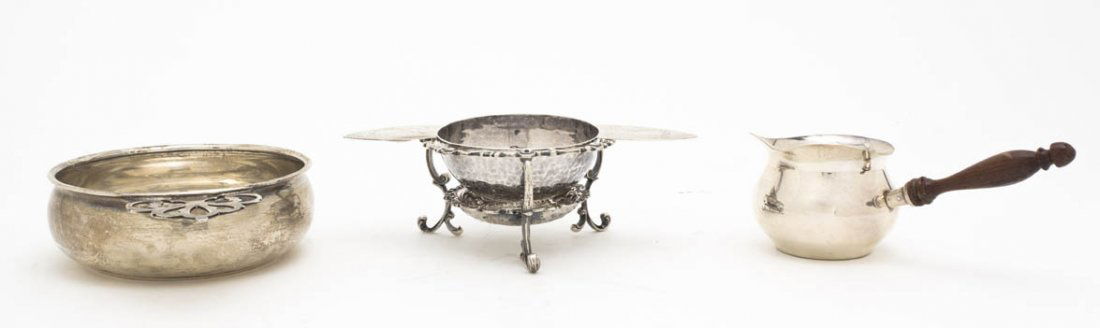 A Collection of American Sterling Silver Table Ar: A Collection of American Sterling Silver Table Articles, comprising a porringer, a tea strainer and a syrup; approximate total weight overall 9.35 ozt. Width of widest 5 3/4 inches. Property from the