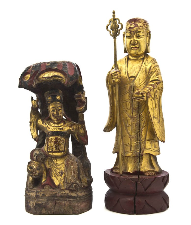 Two Chinese Lacquered and Gilt Temple Figures, He: Two Chinese Lacquered and Gilt Temple Figures, one depicting the God of Wealth seated on a tiger, the other a standing Buddha with a staff, raised upon a double lotus base. Height of tallest overall 1