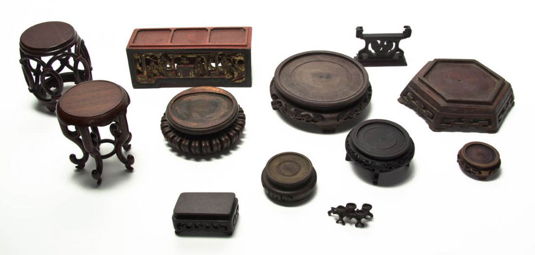 A Group of Twelve Carved Hardwood Stands, Width o: A Group of Twelve Carved Hardwood Stands, of varying forms and sizes. Width of widest 8 1/2 inches.
