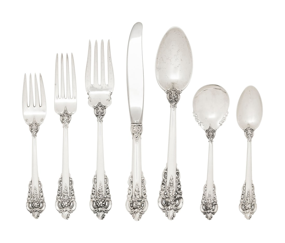 An American Silver Flatware Service: An American Silver Flatware Service Wallace Silversmiths, Wallingford, CT, 20th Century Grand Baroque pattern, comprising: 10 dinner knives 10 dinner forks 10 salad forks 16 teaspoons 9 soup spoons 1