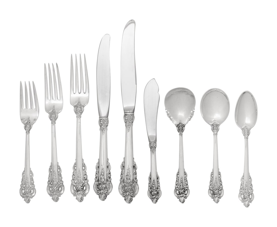 An American Silver Flatware Service: An American Silver Flatware Service Wallace Silversmiths, Wallingford, Connecticut, 20th Century Grand Baroque pattern, comprising: 12 dinner knives 12 luncheon knives 12 forks (8 inch) 12 forks (7 1/