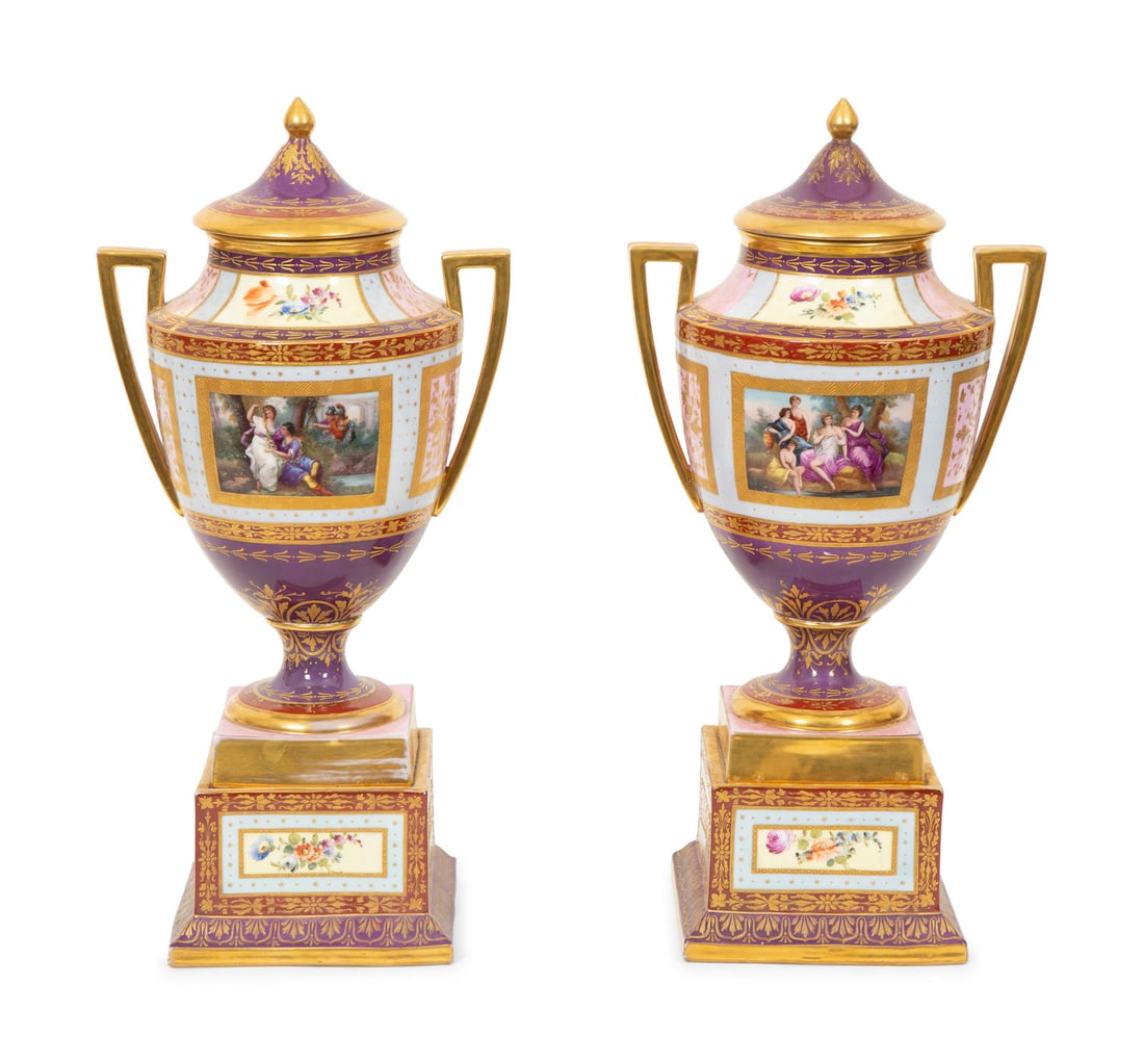 A Pair of Vienna Porcelain Urns and Covers: A Pair of Vienna Porcelain Urns and Covers 19th/20th Century the underside of each marked with shield emblem in underglaze blue; one example inscribed Venus von Nimphen Umgben and Jupiter und Callisto
