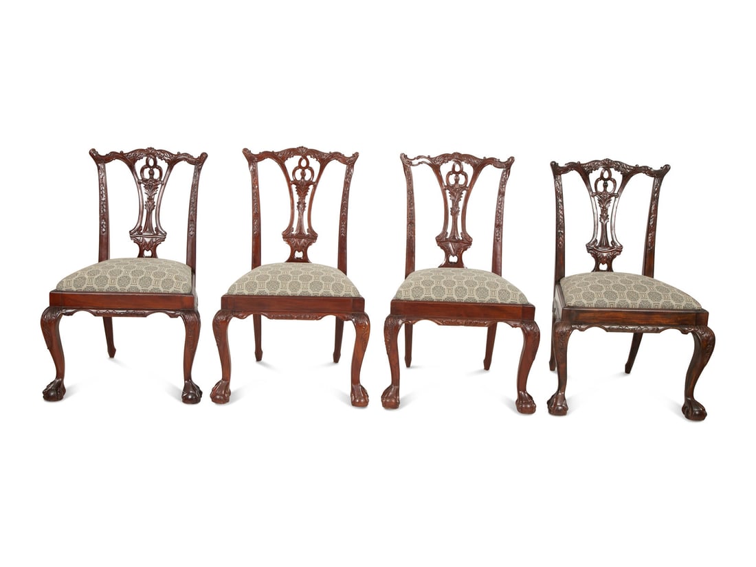 A Set of Ten George III Style Mahogany Dining Chairs: A Set of Ten George III Style Mahogany Dining Chairs 20th Century comprising two armchairs and eight side chairs (one with a different wood finish). Height 40 inches.