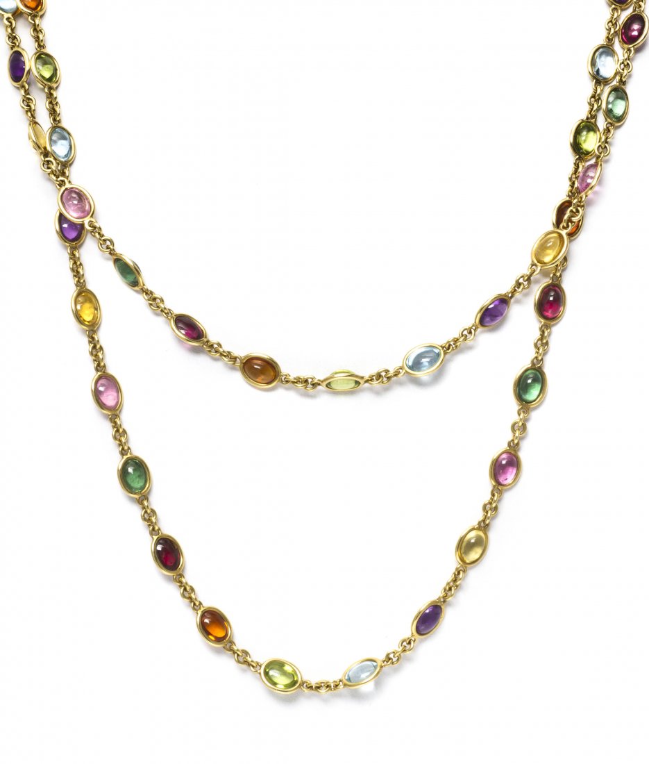 An 18 Karat Yellow Gold and Multi Gem Necklace, It: An 18 Karat Yellow Gold and Multi Gem Necklace, Italian, containing various oval cabochon cut gem cabochons including amethyst, citrine, aquamarine, peridot, garnet and tsavorite garnet. Stamp: 750 91