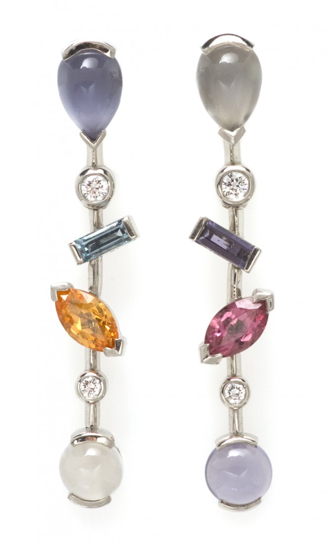 A Pair of Platinum, Diamond and Multi Gemstone Mel: A Pair of Platinum, Diamond and Multi Gemstone Meli Melo Earrings, Cartier, containing eight cabochon cut and faceted gems including blue chalcedony, moonstone, garnet, iolite and aquamarine, together