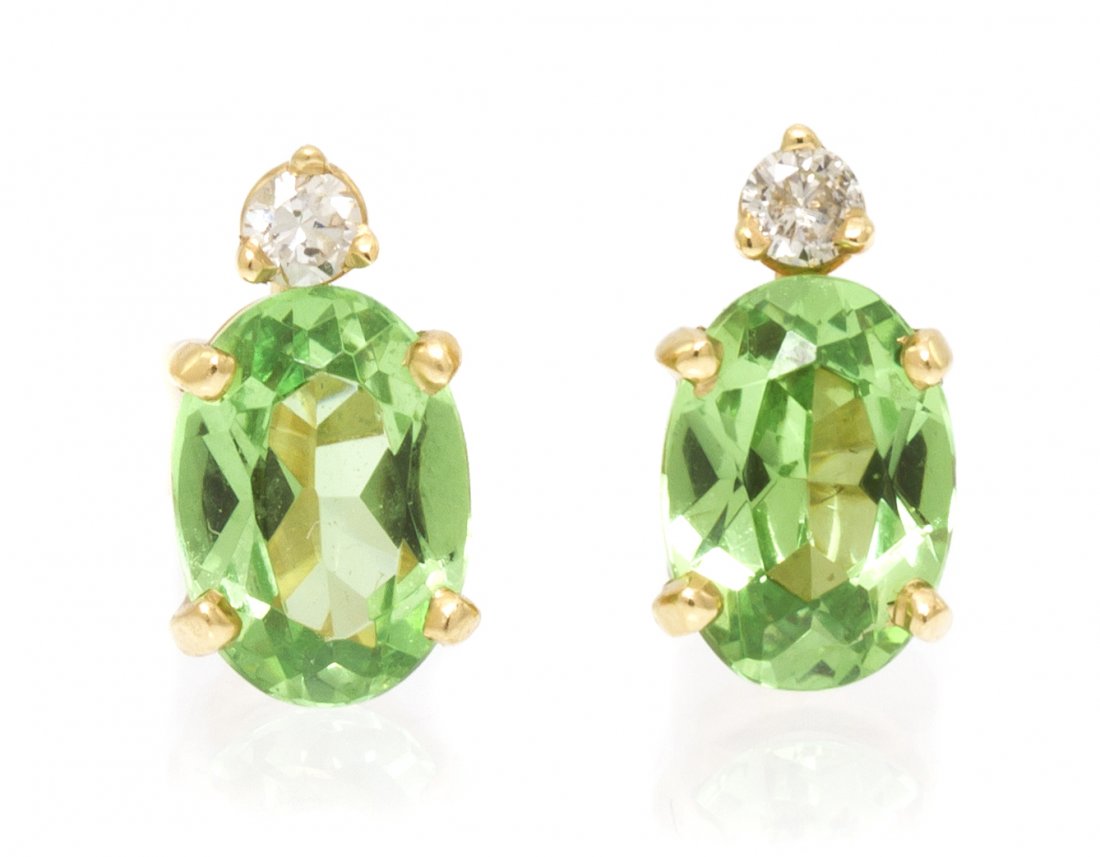 A Pair of 14 Karat Yellow Gold, Tsavorite Garnet a: A Pair of 14 Karat Yellow Gold, Tsavorite Garnet and Diamond Earrings, containing two oval brilliant cut tsavorite garnets weighing approximately 1.22 carats total and two round brilliant cut diamonds