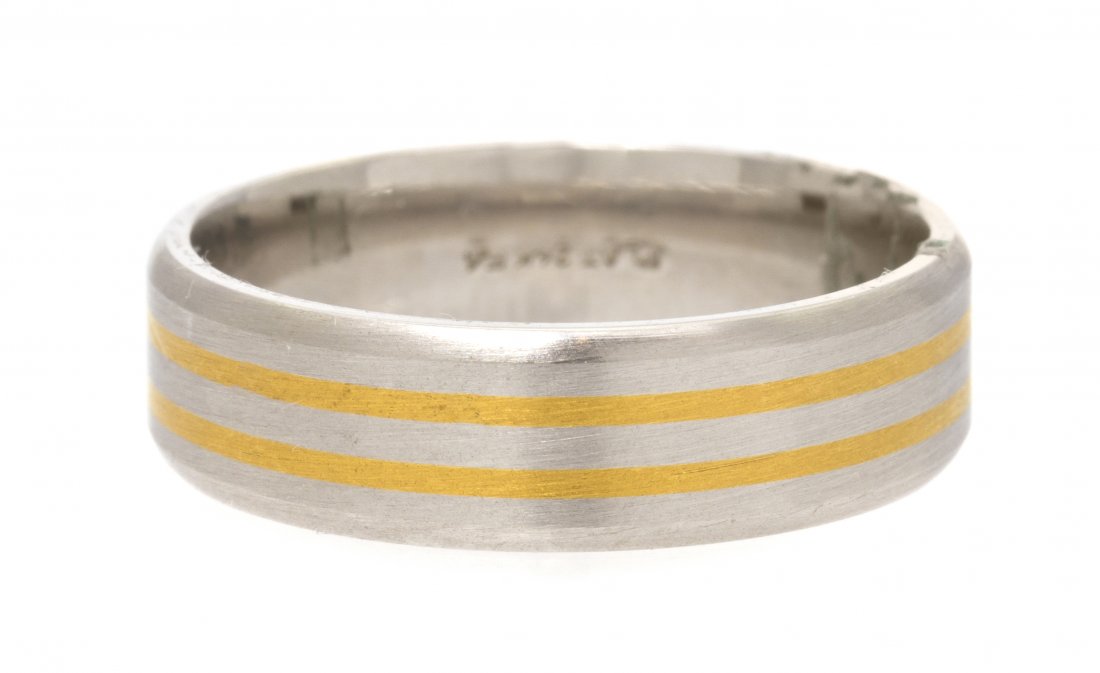 A 24 Karat Yellow Gold and Platinum Band, 7.00 dwt: A 24 Karat Yellow Gold and Platinum Band, in a five row laminated layer design. Stamp: PLAT 24K. 7.00 dwts. Property from the Collection of Stan Krandall, Former Owner of Sidney Krandall & Sons, Troy,