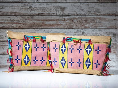 Sioux Beaded Hide Possible Bags, Matched Pair: Sioux Beaded Hide Possible Bags, Matched Pair fourth quarter 19th century sinew-sewn thick hide and beaded using colors of pink, cobalt, light blue, greasy yellow, white, pea green, and translucent gr