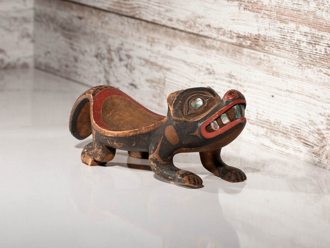 Northwest Coast Carved Beaver Bowl: Northwest Coast Carved Beaver Bowl ca 1900 carved in the form of a beaver and painted in red, brown, and black; abalone inlay for eyes and teeth height 4 inches x length 12-1/2 inches This lot is loca