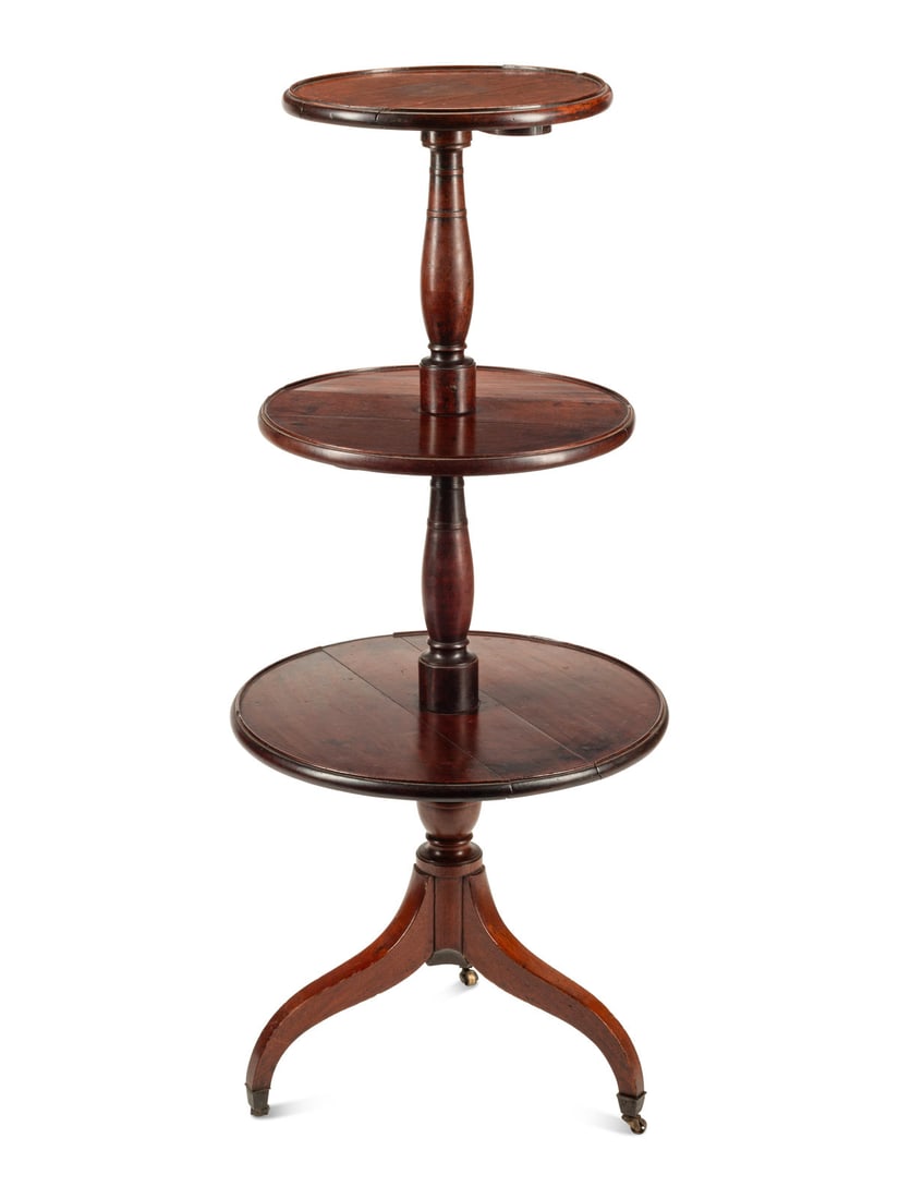 A George III Mahogany Dumbwaiter: A George III Mahogany Dumbwaiter Late 18th/Early 19th Century Height 52 x diameter 22 inches. This lot is located in Chicago.