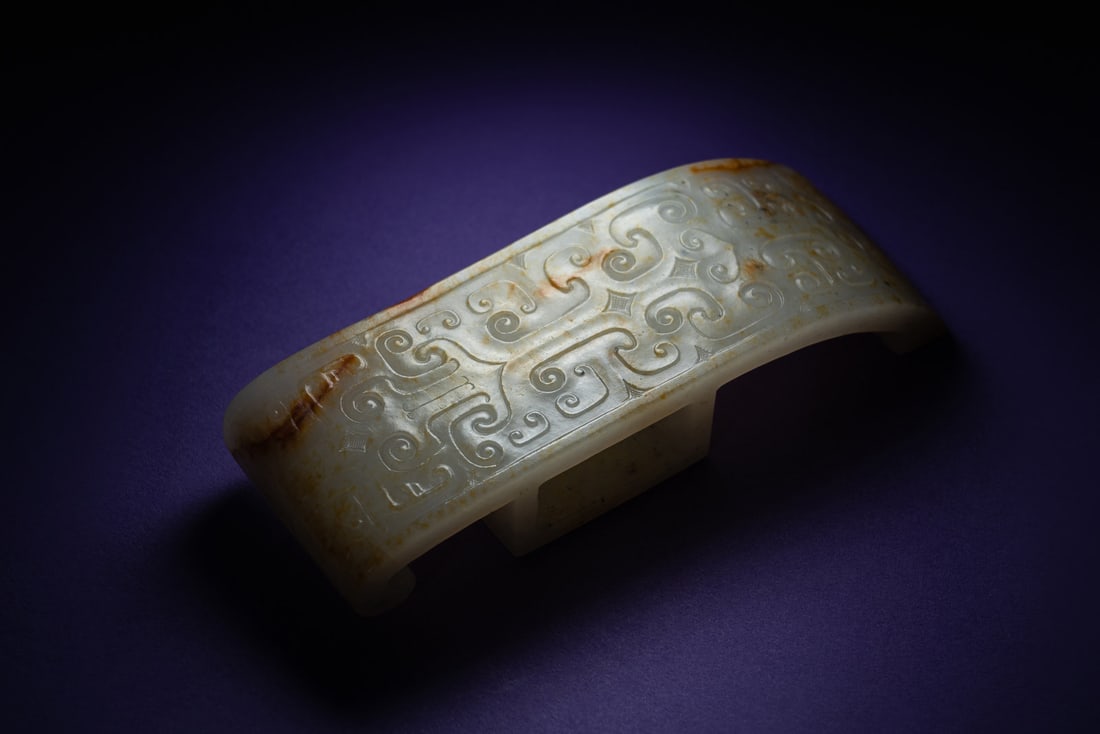 A Chinese White and Russet Jade Sword Slide, Jianzhi (1 of 5)