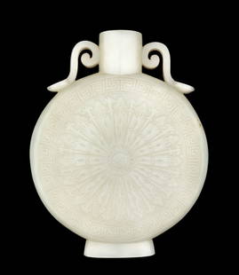 A Chinese Pale Celadon Jade Moon Flask: A Chinese Pale Celadon Jade Moon Flask Late Qing Dynasty 清晚期 青白玉浮雕如意紋抱月瓶 the flattened body carved on