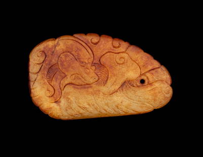 A Chinese Russet and White Jade 'Dragon' Pendant: A Chinese Russet and White Jade 'Dragon' Pendant Late Ming Dynasty (17th Century) 晚明 白玉魚化龍牌 carved in low relief in the form of a dragon carp