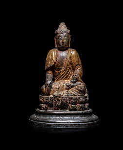 A Chinese Carved Wood Figure of Buddha Shakyamuni: A Chinese Carved Wood Figure of Buddha Shakyamuni 彩繪木雕釋迦牟尼坐像 seated in vajraparyankasana on a double lotus base rising from a wood