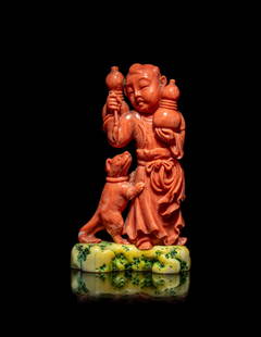 A Chinese Coral Figural Group of a Boy and a Dog: A Chinese Coral Figural Group of a Boy and a Dog &#29642;&#29786;&#31461;&#23376;&#25135;&#29356;&#25850;&#20214; the boy figure carved standing, wearing loose robes, each hand holding a large gourd,