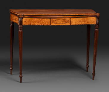 A Federal Birch Veneered and Inlaid Mahogany Serpentine-Top Games Table: A Federal Birch Veneered and Inlaid Mahogany Serpentine-Top Games Table New England, Circa 1800 Height 29 3/4 x width 38 3/4 x depth 18 1/4 inches. This lot is located in Cincinnati. Property from the
